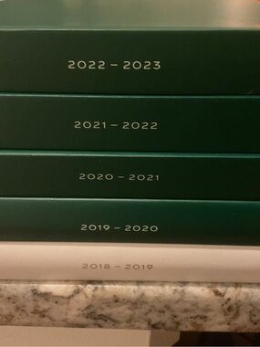 Rolex Green and Cream Yearly Catalog Stack, with the latest designs & changes